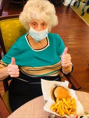 Joan Inklebarger gives her lunch a "two thumbs up."