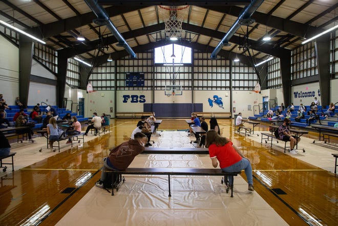 Fort Braden School 6th, 7th and 8th graders sit in the gymnasium with enforced social distancing while waiting for the first day of school to begin Monday, August 31, 2020. 