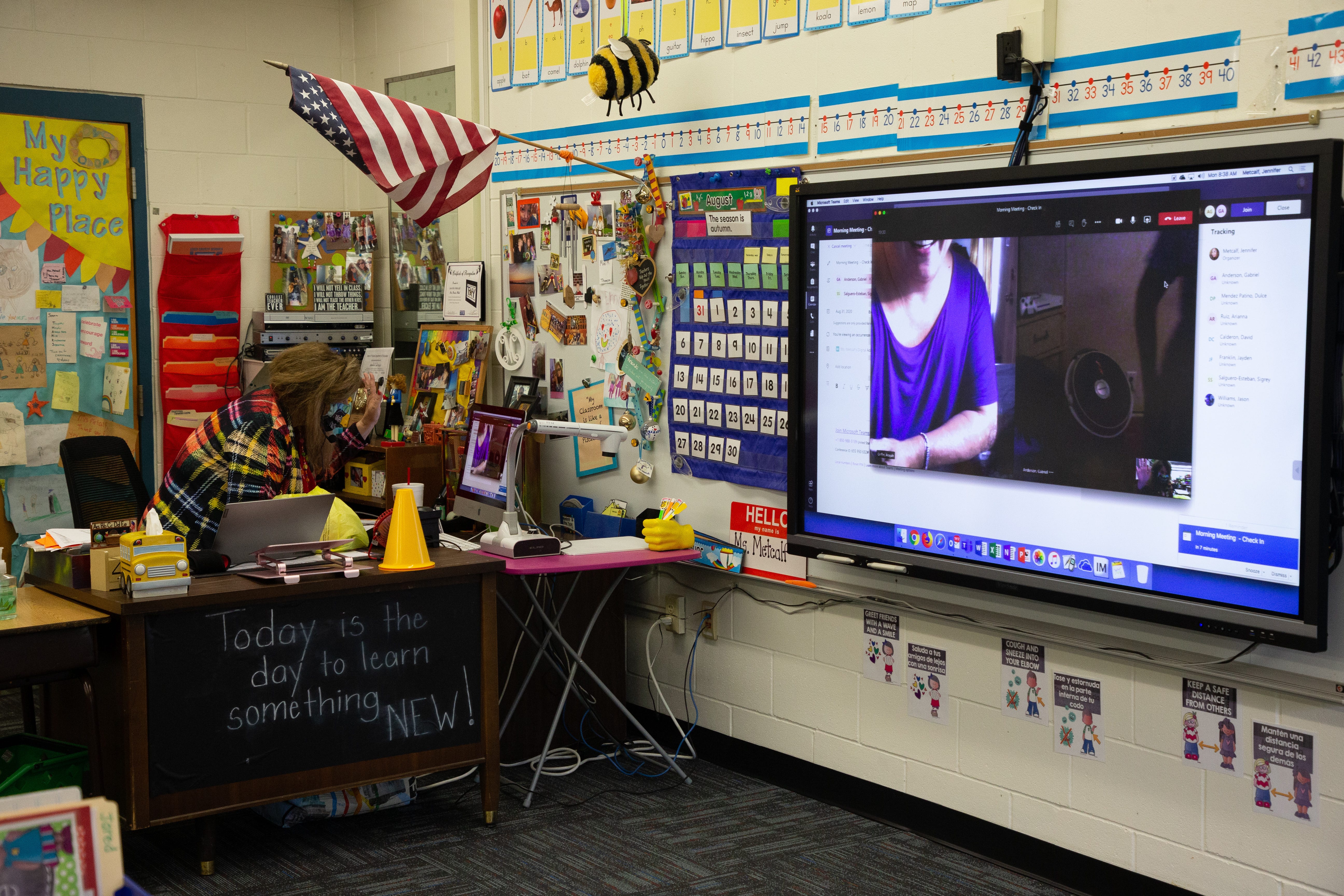 A Fort Braden School teacher greets students tuning into class digitally on the first day of school Monday, August 31, 2020. 