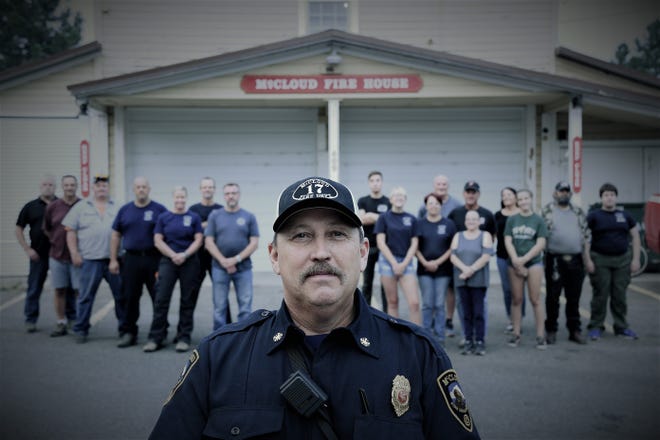 McCloud's new Fire Department Chief Charlie Miller stands in front of the mostly new volunteer firefighters  he recruited in hopes of making the department more self-sufficient and prepared to serve the McCloud community.