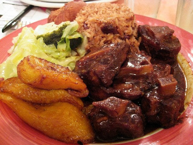 Oxtails, plantains, rice and beans, and cabbage are traditional Caribbean treats; these are from Michelle's Kitchen and Catering Service in Vineland. Variations of rice and beans are found in much pan-African cooking. Jazz great Louis Armstrong, a native of New Orleans, used to sign his letters "red beans and ricely yours."