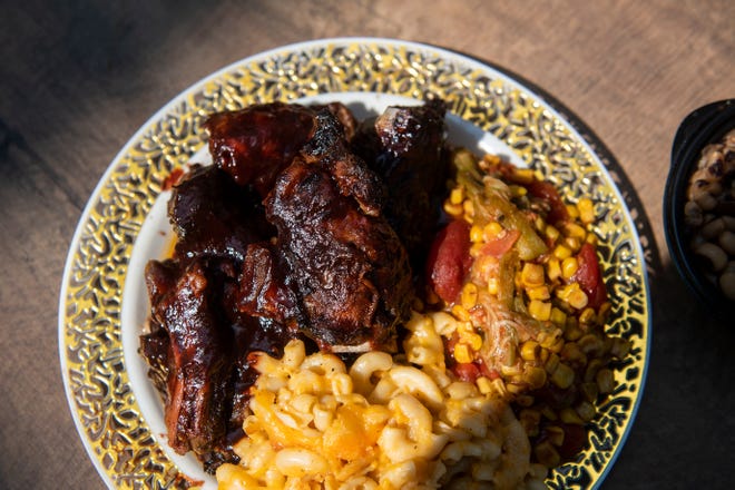 Ribs, macaroni and cheese and mixed vegetables are shown from Corinne's Place. The iconic Camden eatery won a 2022 James Beard Foundation America’s Classics Award.