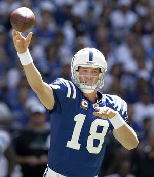 Indianapolis Colts' Peyton Manning passing his way into the Hall of Fame.