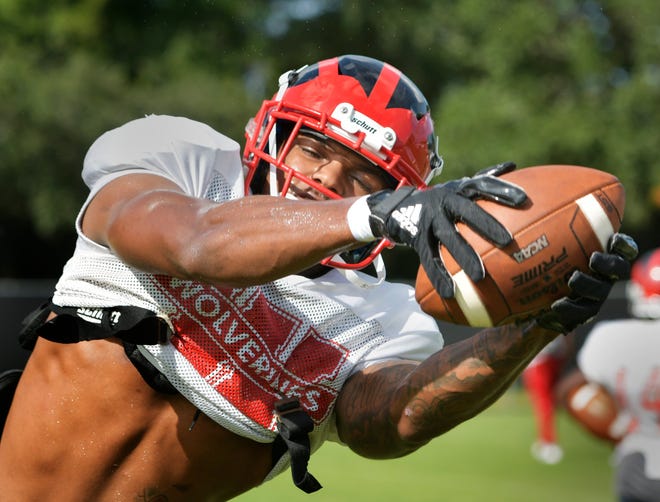 Westside tight end Chris Johnson snags a pass during an Aug. 27 practice. [Will Dickey/Florida Times-Union]