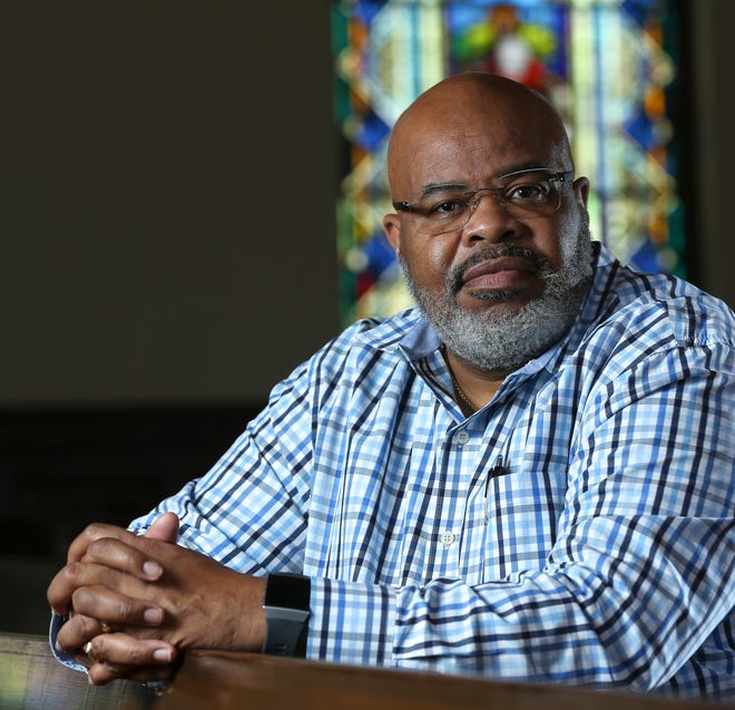 Clinton Hubbard is the pastor of First United Methodist Church in Tuscaloosa, a majority white congregation. He was photographed in the church sanctuary Wednesday, Sept. 2, 2020. [Staff Photo/Gary Cosby Jr.]
