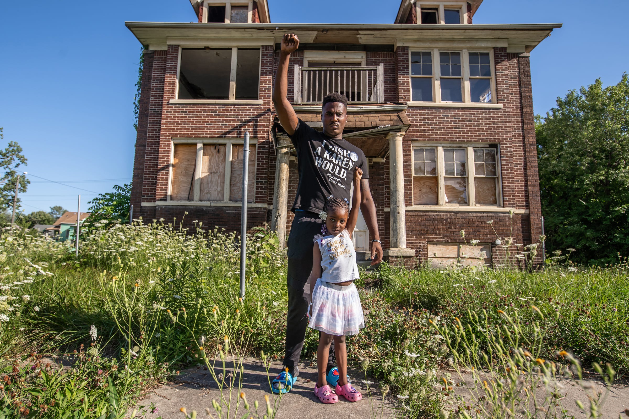 Jae Bass, 25, of Detroit poses for a photo with his daughter Daria Bass, 5, in front of an abandoned house on Collingwood Street in Detroit on Thursday, August 20, 2020. "I look around, I see abandoned houses. I see degradation. I see desolate areas and I think I'm finally at an age and experienced enough to understand that that is all on purpose. It just is not a lack of resources because of the lack of resources. It is a lack of resources because we are intentionally being starved of resources so that we have limited options on how to get resources which just further perpetuates crime and other things in my neighborhood. So the reason I march is because I know the only way that's gonna change is if the people come together and actually make that change happen. If this is truly a democracy, it means that the country should run off of what the needs and desires of the people are. That we need to take that power back. So we get in the streets and we take that power back," Bass said.
"If you didn't think that we would be out here a hundred days, you are truly underestimating the power of this movement because we'll be out here a hundred more days and one hundred more days after that. However long it takes to get justice and truly make change that's gonna be everlasting in our city, state and country and eventually the world."