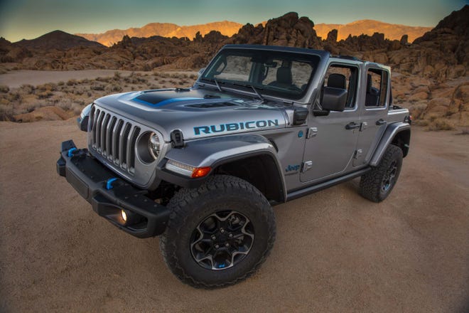 The 2021 Jeep Wrangler Rubicon 4xe pairs a 2.0-liter turbo engine with two electric motors.