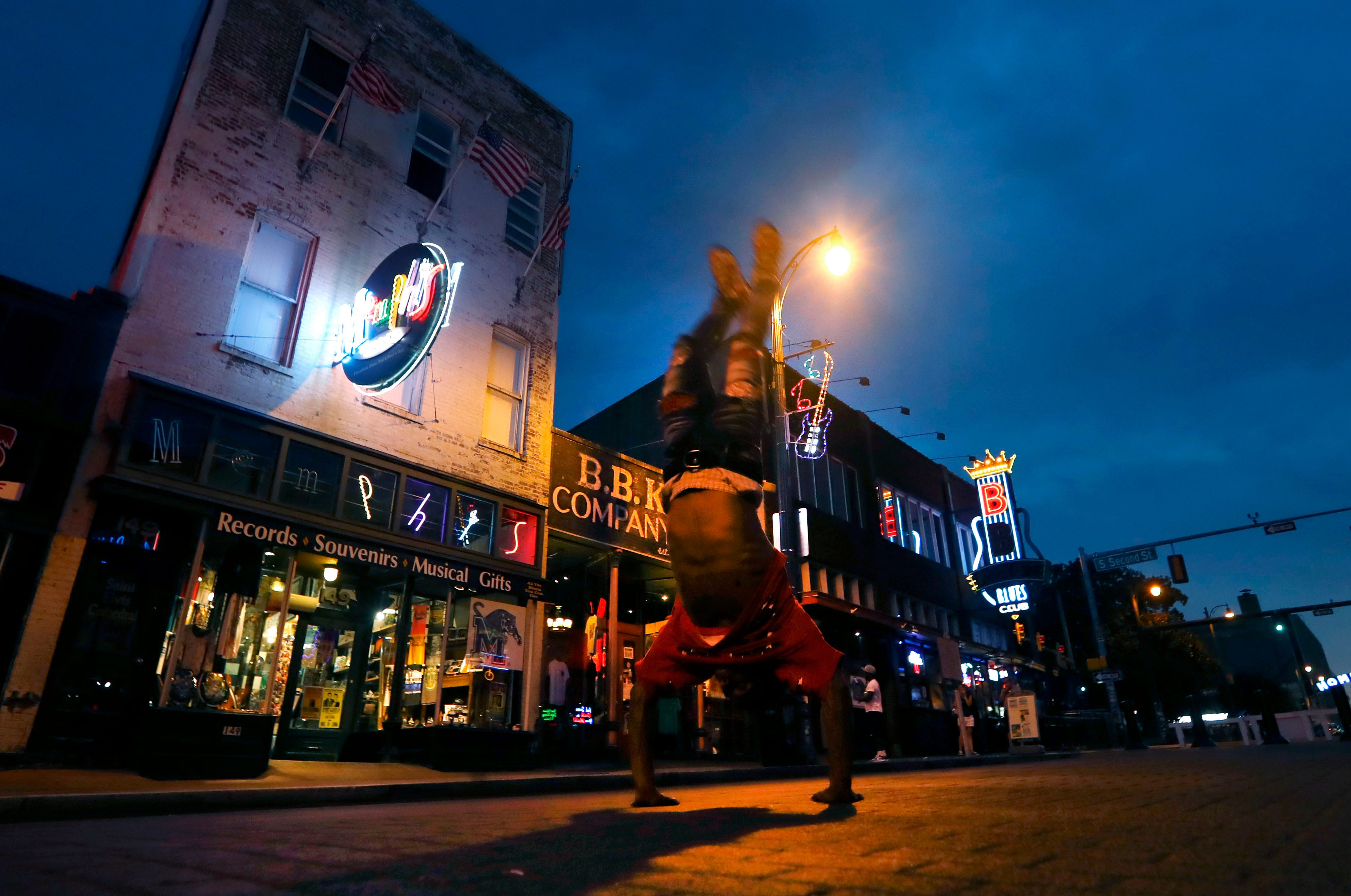 Clarence Henderson flips down Beale Street after sunset on Tuesday, Sept. 1, 2020.