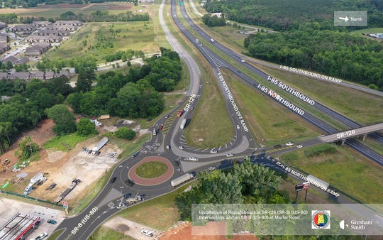 This rendering from a virtual presentation shows plans for one of three roundabouts near Interstate 85 and Pike Road.