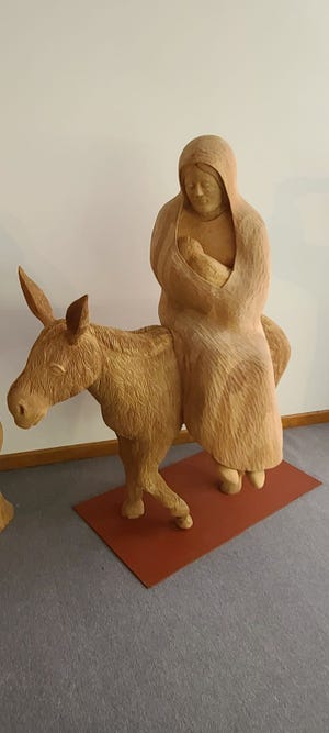 This carving of Mary holding baby Jesus while riding a donkey is one of the creations of the late Joseph Barta, who spent 30 years carving his vision of Bible stories into 100 life-size figures.