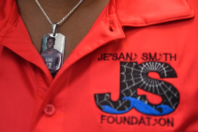 Kiwana Patterson Denson wears a photo of her son, Je'Sani, before receiving a check for $5,000 to the Je'Sani Smith Foundation, Thursday, Sept. 3, 2020. Denson started the foundation to promote beach safety after her son, a King High School student, drowned near Bob Hall Pier in April 2019. 