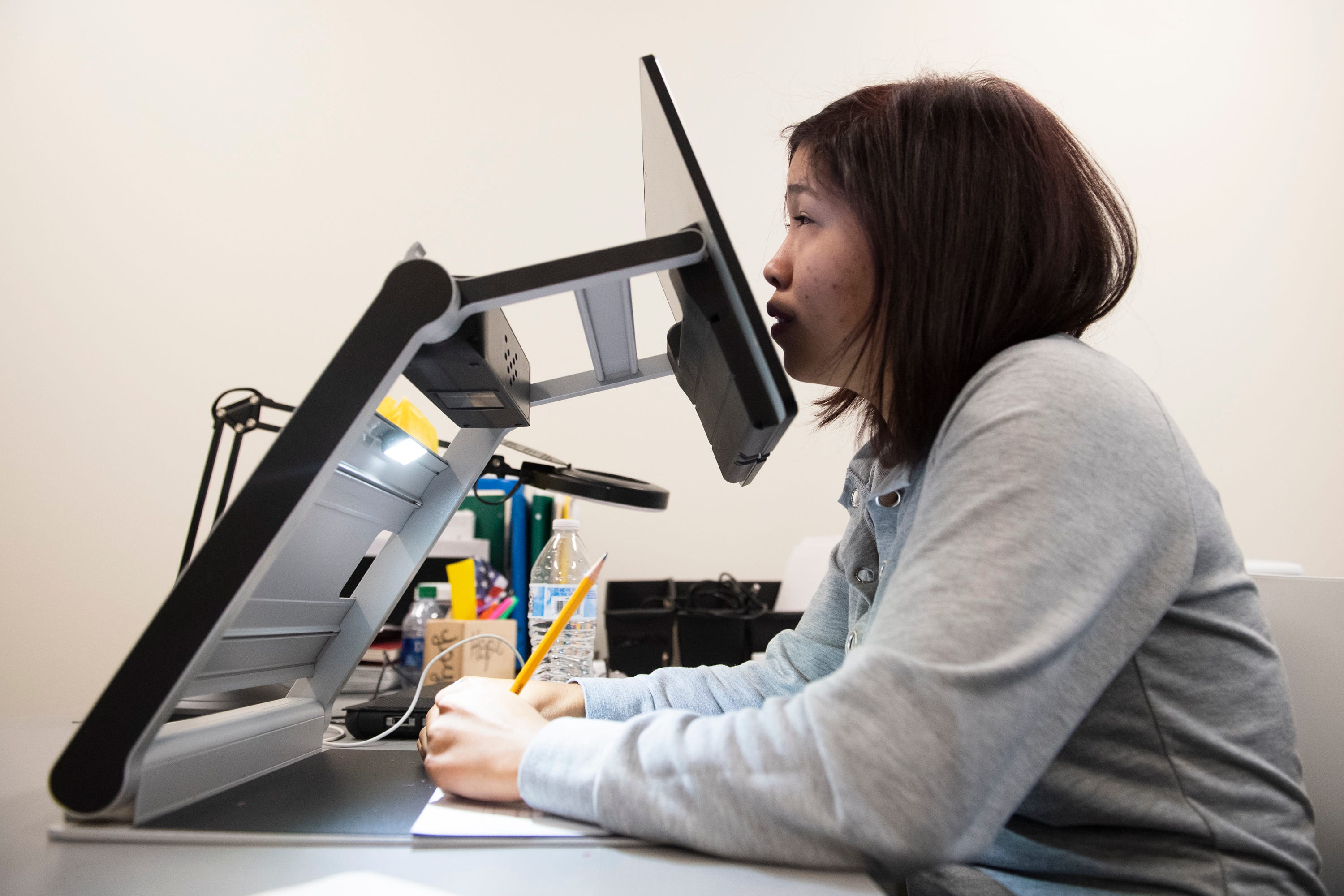 Fatima Quintana uses a VisioBook to work on her school assignments at Spartanburg High School Monday, March 2, 2020.