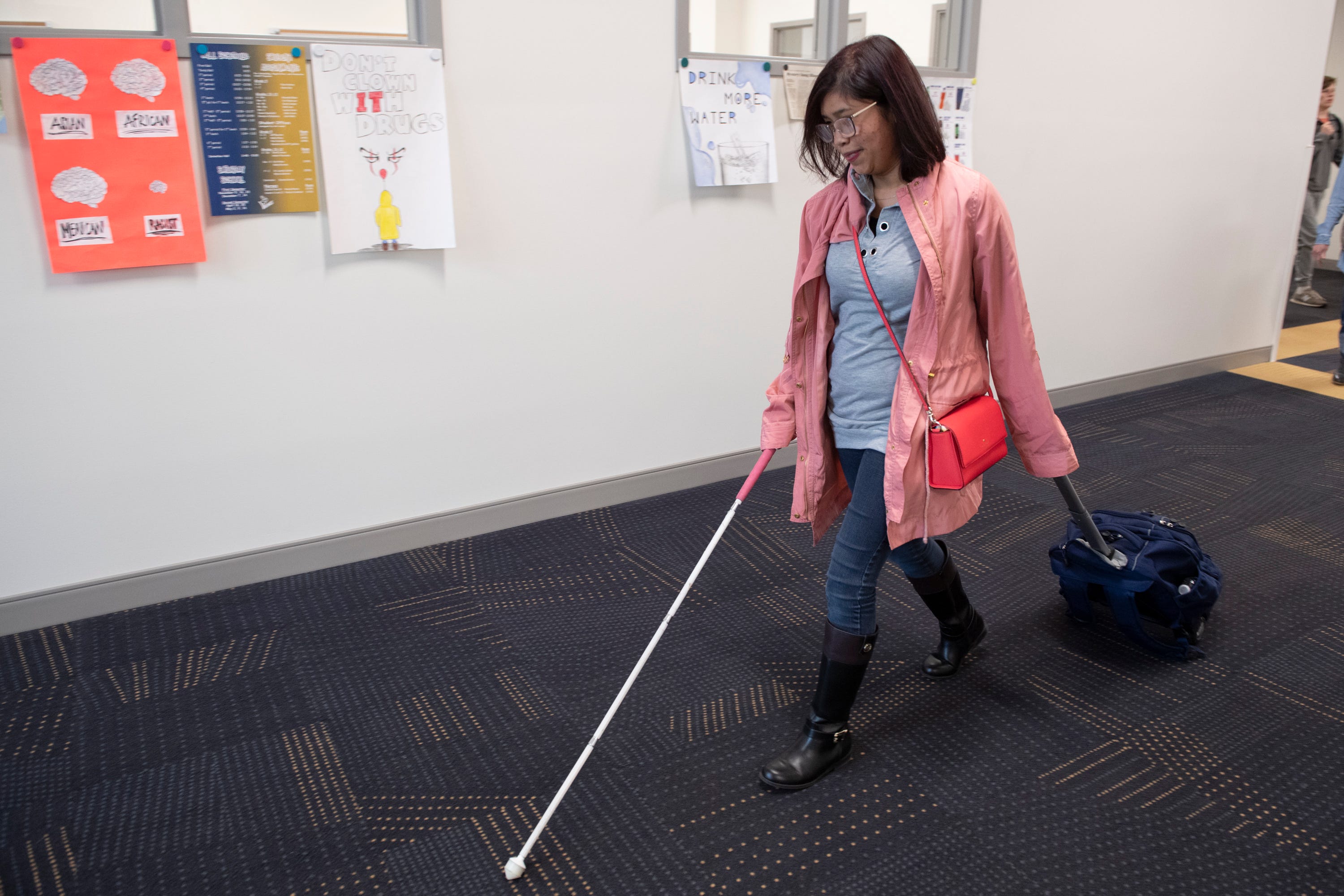 Fatima Quintana walks through Spartanburg High School Monday, March 2, 2020.