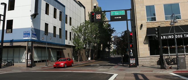 On Sept. 5, 2020, a small section of West First Street, at the corner of North Sierra Street, is being closed for limited on-street food and drink provided by Liberty Food & Wine Exchange, left, and Blind Dog Tavern. The event is the first approved street closing by the City of Reno during the pandemic in order to allow for on-street drinking and dining.