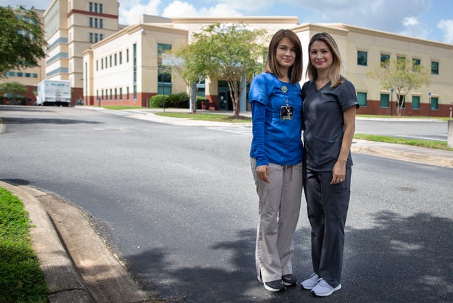 Twin sisters Wendy Merlos, left, and Suzana Oquendo are both employed at Capital Regional Medical Center. 