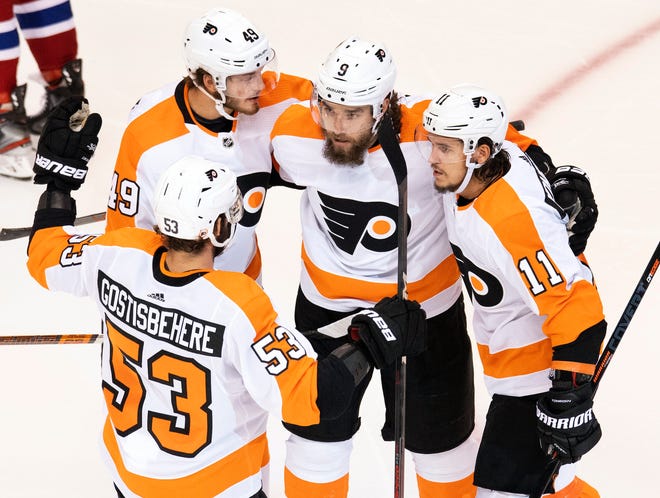 The Flyers', from left, Shayne Gostisbehere, Joel Farabee, Ivan Provorov and Travis Konecny celebrate a playoff goal against the Canadiens.