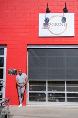 J. Hackett stands outside the coffee shop he will be opening with business partner, Gene Ettison, in the River Arts District. Grind Coffee Co., which will also act as a coworking space and will seek to nurture entrepreneurship with additions like mailboxes, will be the first Black-owned coffee shop in Asheville. 