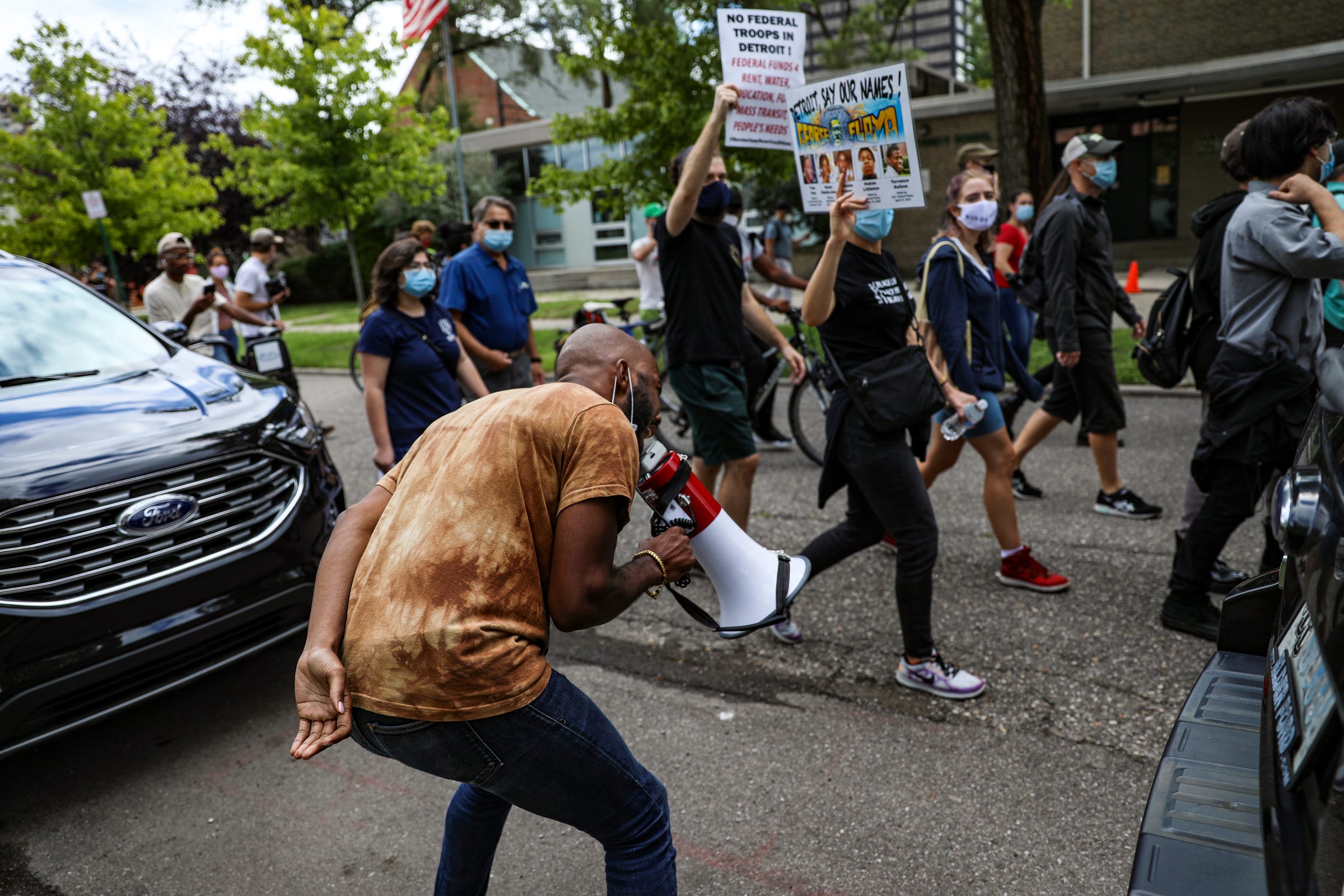 Fernando Willis Jr., 26, of Detroit keeps the energy high in the rear as he marches with Detroit Will Breathe through the Corktown neighborhood of Detroit on Saturday, Aug. 29, 2020 to kickoff the Equity First, Solidarity Works labor resource fair. The Unions United for Change event brings together local union members, community residents and activists to share information and provide network opportunities.