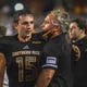 Southern Miss Golden Eagles quarterback Jack Abraham speaks with head coach Jay Hopson during their Conference USA football game against the South Alabama Jaguars at M.M. Roberts Stadium in Hattiesburg, Miss., Thursday, Sept. 30, 2020.
