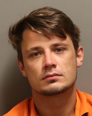 Dustin Blake Burt, 25, was charged with two counts of possession of child pornography.