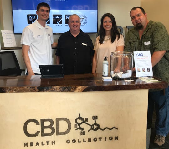 From left: Ryan Marienau, Rick Bauer, Ashley Bauer Marienau and Jon Bauer at Thursday's opening of CBD Health Collection in Granville.