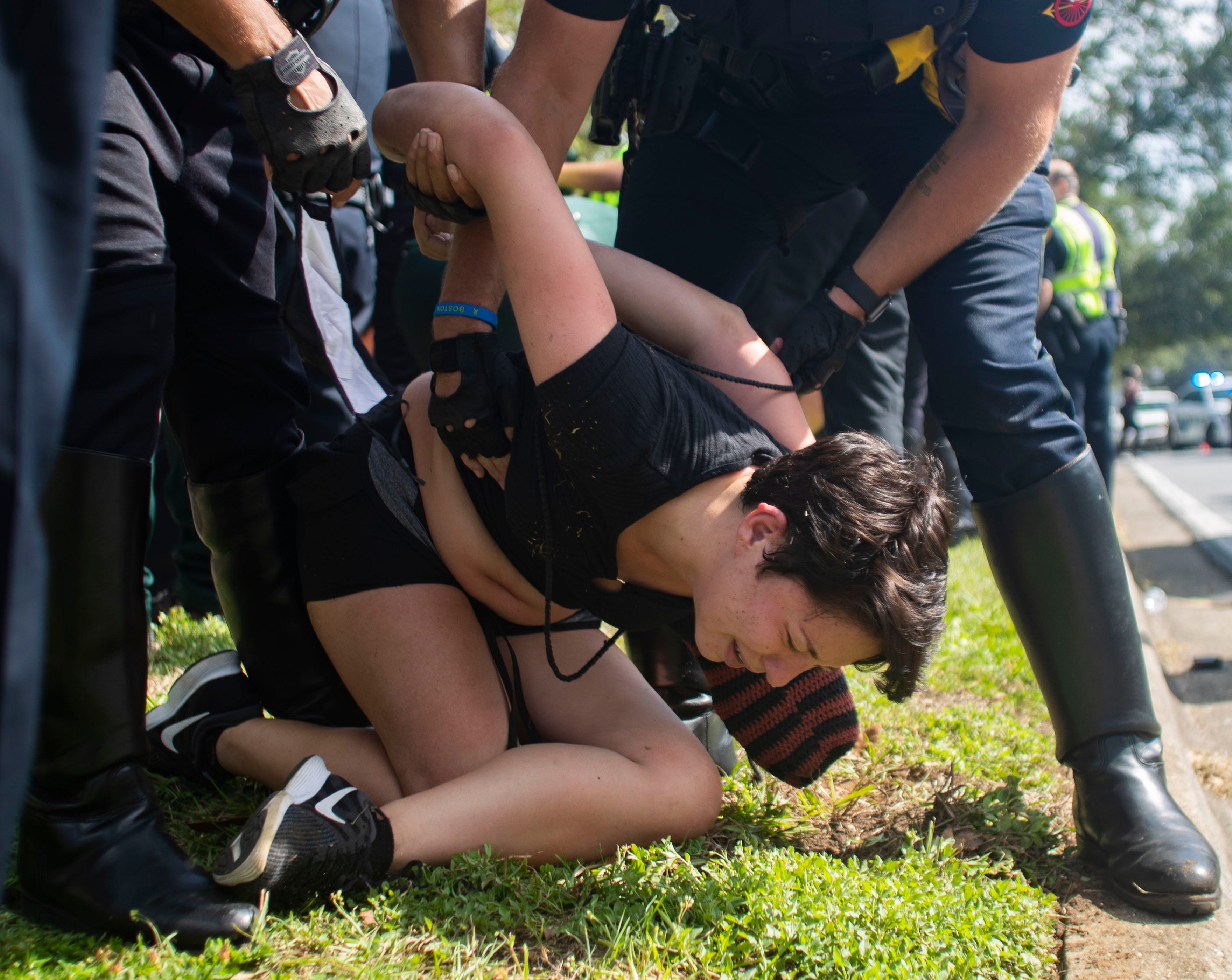 Law enforcement officers take several Black Lives Matter protesters into custody during a peaceful march Saturday, Sept. 5, 2020.