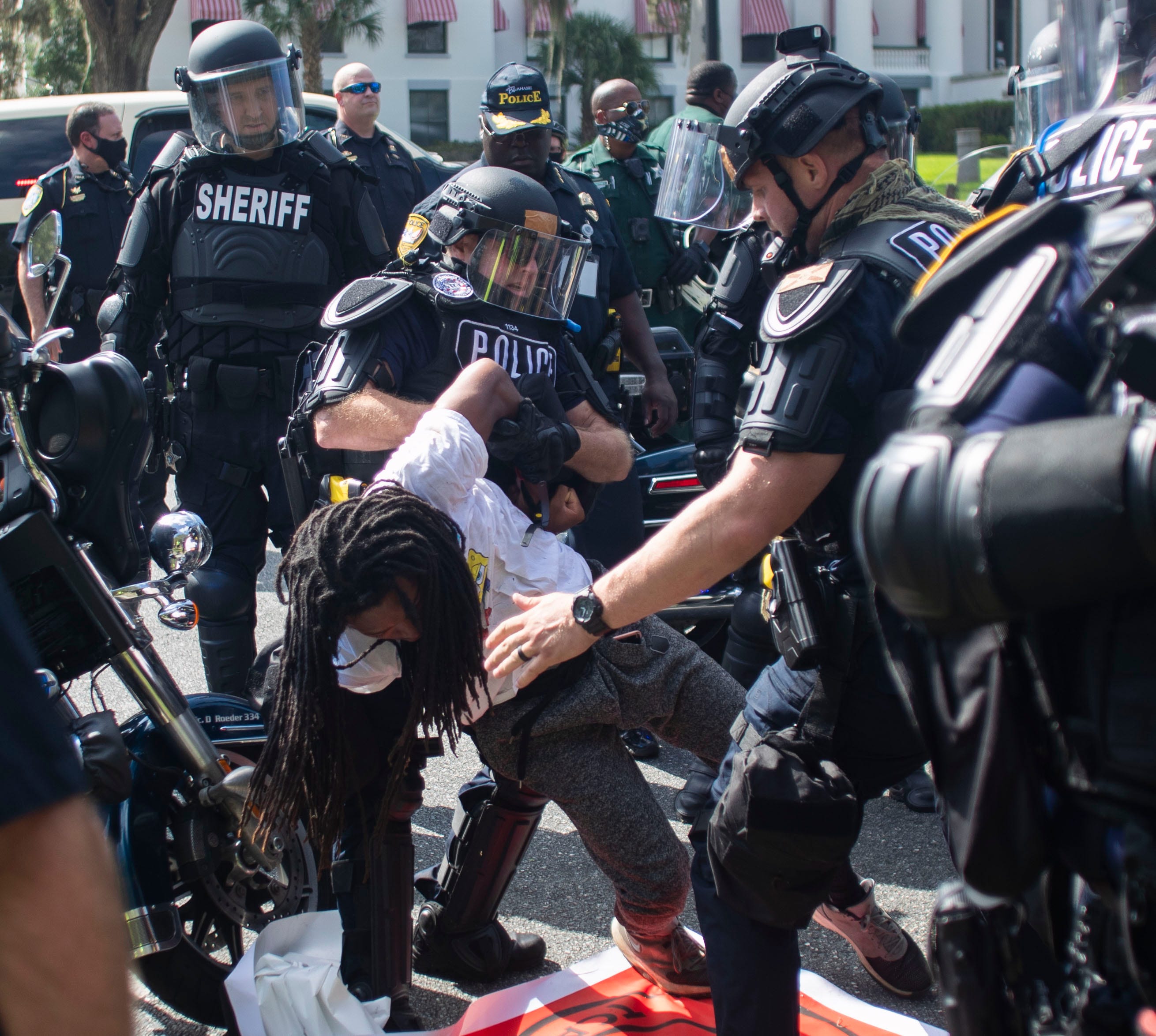 Law enforcement officers take several Black Lives Matter protesters into custody during a peaceful march Saturday, Sept. 5, 2020.