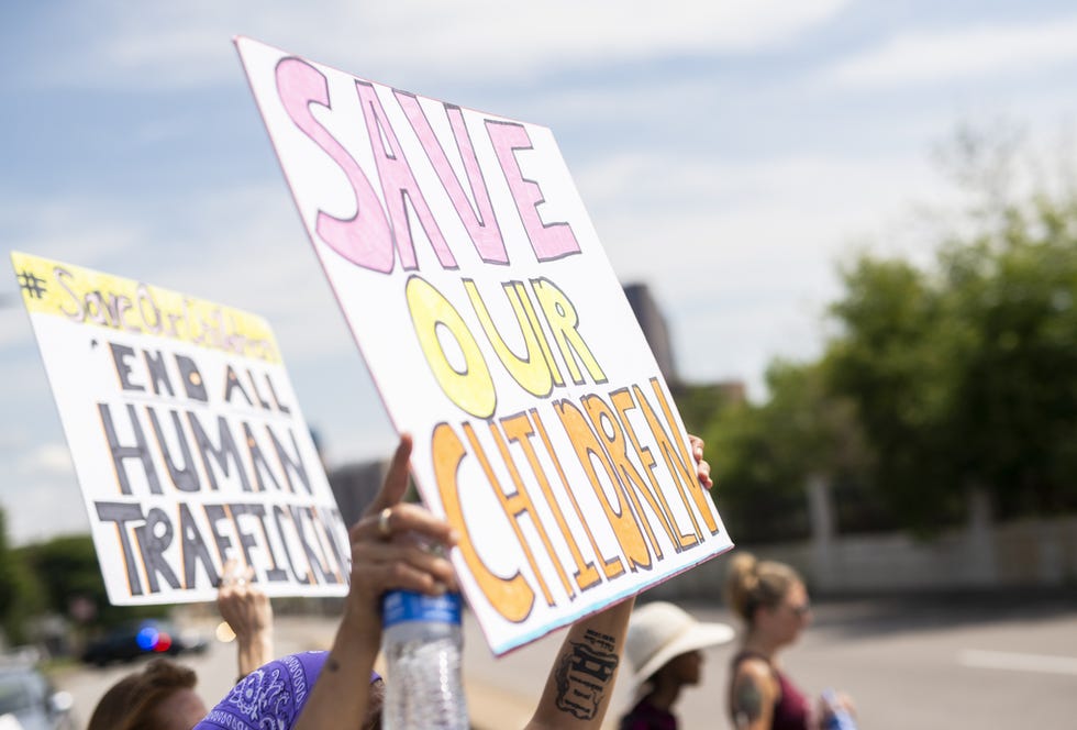 People march during a "Save the Children" rally outside the Capitol on Aug. 22, 2020, in St. Paul, Minn.