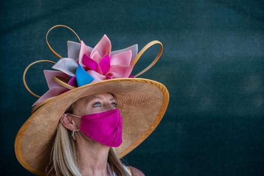 Whitney Byars wears a Christine Moore designed hat to the Kentucky Derby at Churchill Downs on Sept. 5, 2020.