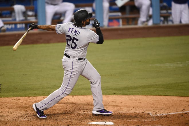 Colorado Rockies' Matt Kemp follows through on a two-run home run during the eighth inning against the Los Angeles Dodgers in Los Angeles, Sunday, Sept. 6, 2020.