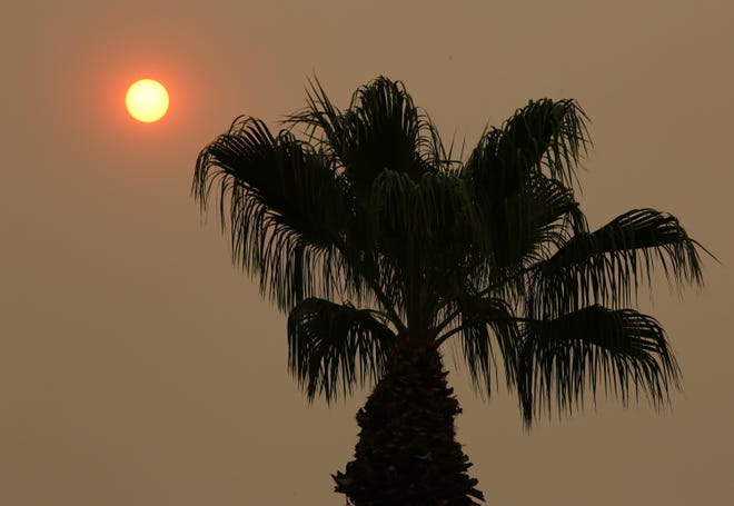 Smoke obscures the sun as seen from Rancho Mirage, Calif., on Tuesday, September 8, 2020. The El Dorado Fire is one of several wildfires currently burning in California. 