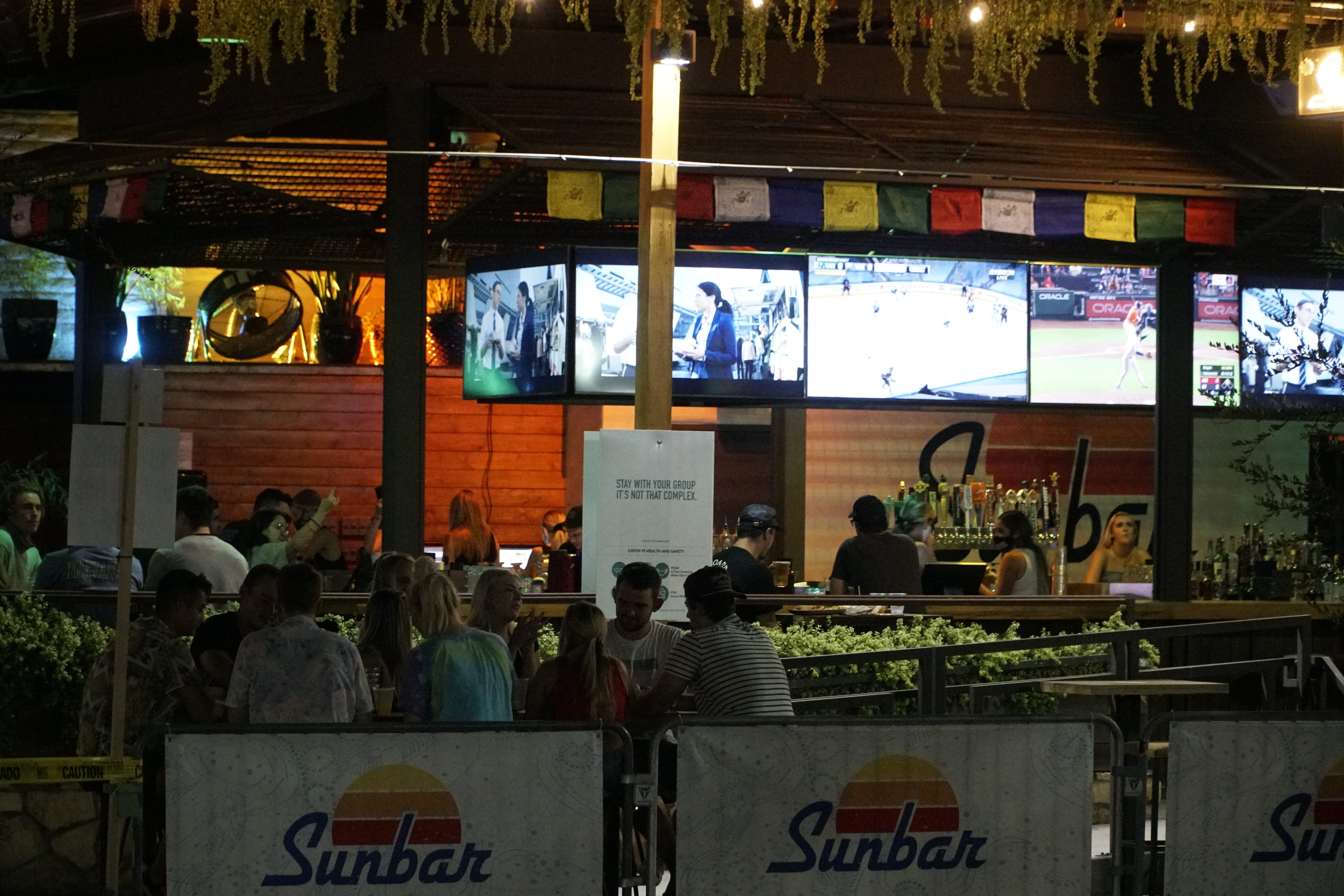 Students gather at a restaurant near the Arizona State University campus on Friday.