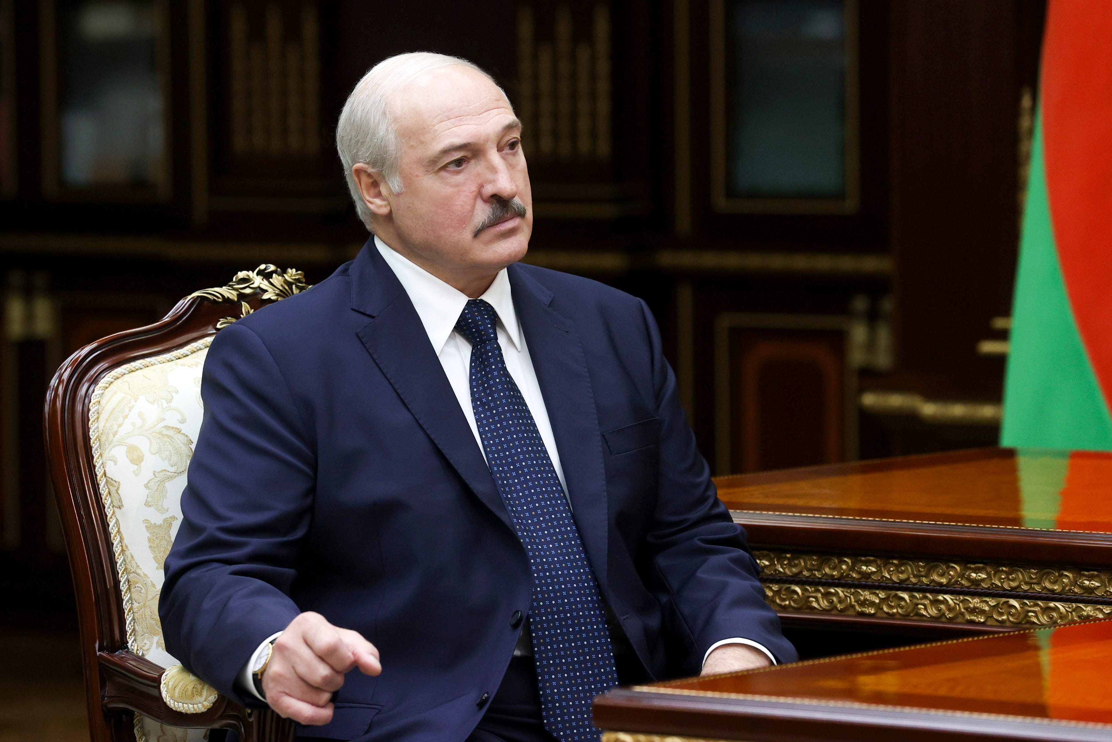 Belarusian President Alexander Lukashenko listens to the head of the Investigative Committee Ivan Naskevich during their meeting in Minsk, Belarus, on Sept. 7, 2020.