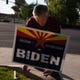 Aug 29, 2020; Gilbert, AZ, USA; John Webster, a member of Arizona Republicans Who Believe in Treating Others with Respect and a Republican precinct committeeman, puts up signs that read, "Arizona Republicans for Biden." Webster is voting for Biden in November because President Trump's morals don't aline with his and doesn't approve President Trump's leadership style. Mandatory Credit: Meg Potter/The Arizona Republic via USA TODAY.
