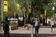 Arizona State University students walk through Taylor Mall at the school's downtown Phoenix campus on Sept. 9, 2020.