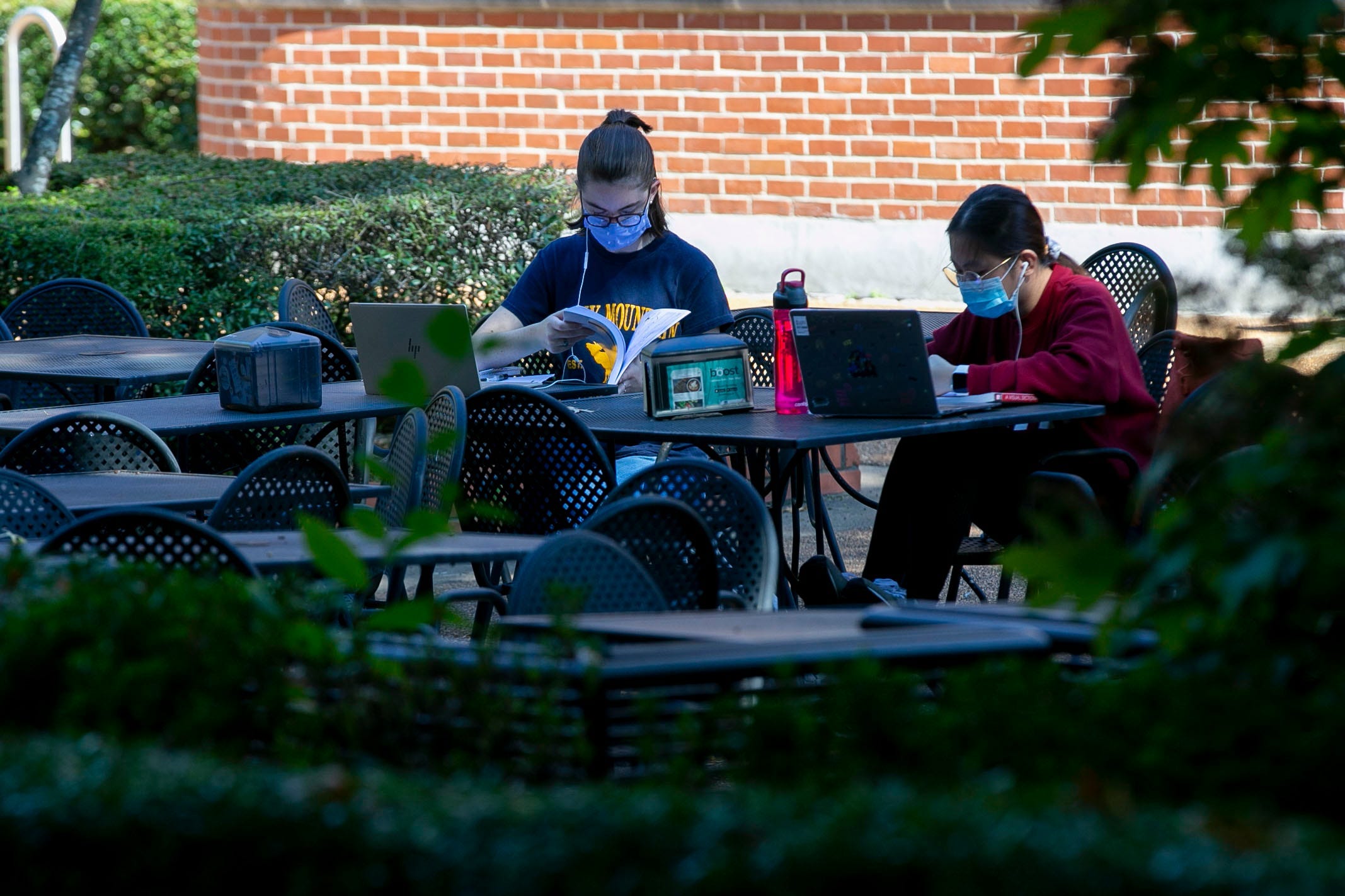 Freshmen Virginia Hensley, left, and Krystel Matutino study in a courtyard after an architecture class on Monday, Aug. 24, 2020, on the University of Memphis campus. While Hensley, who is from Memphis, and Matutino, who is from Bartlett, are completing mostly online courses, the two find it easier to study and focus out being out of the house. "This might be the most campus experience we have this semester," Matutino said.