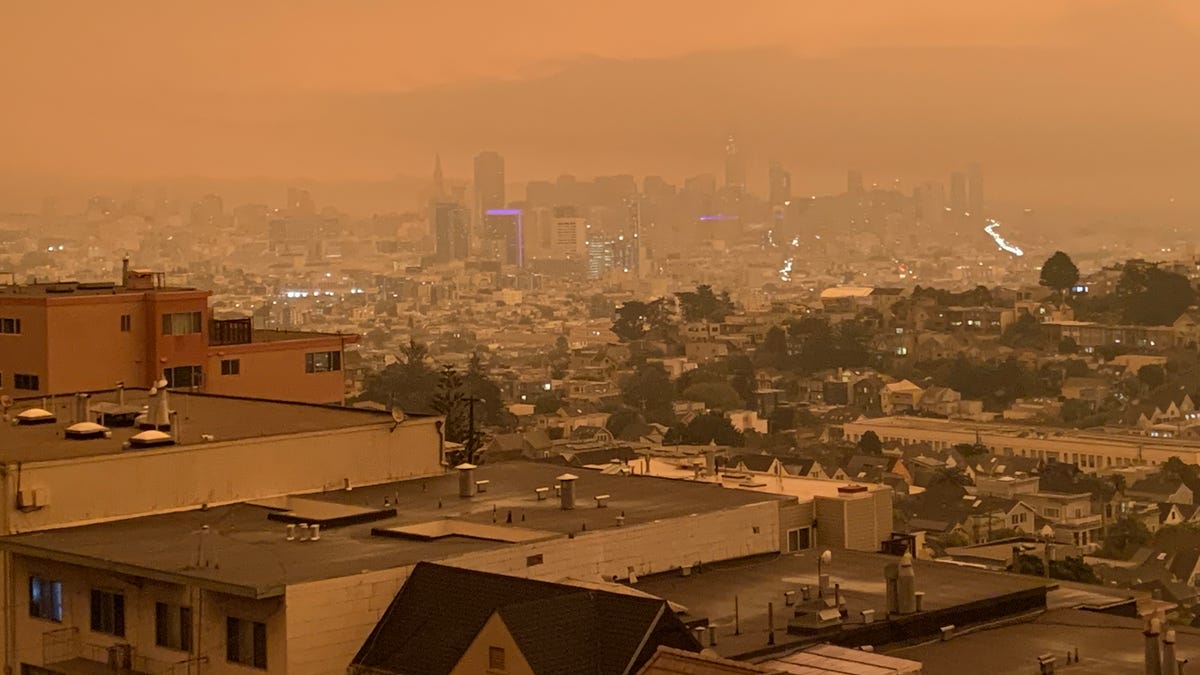 Downtown San Francisco at noon on Wednesday, September 9, 2020 as smoke from multiple wildfires in the region tints the air reddish-orange.