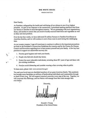 Some needy families were confused and angry about a letter from President Donald Trump inserted into government food boxes distributed at the Guatemalan Maya Center in Lake Worth on Aug. 22, 2020. Organizers and volunteers said the letter, inserted two months before the election, politicized the families' plight.