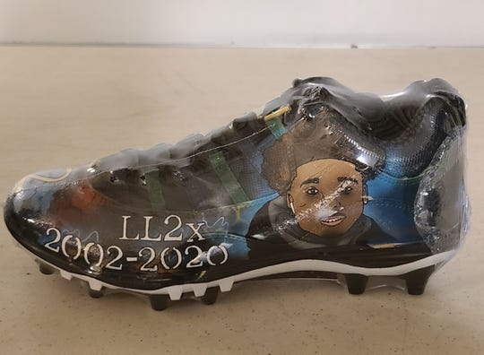 Cathedral senior Jayden Scruggs had his shoes custom-made to honor Mario McCullough.