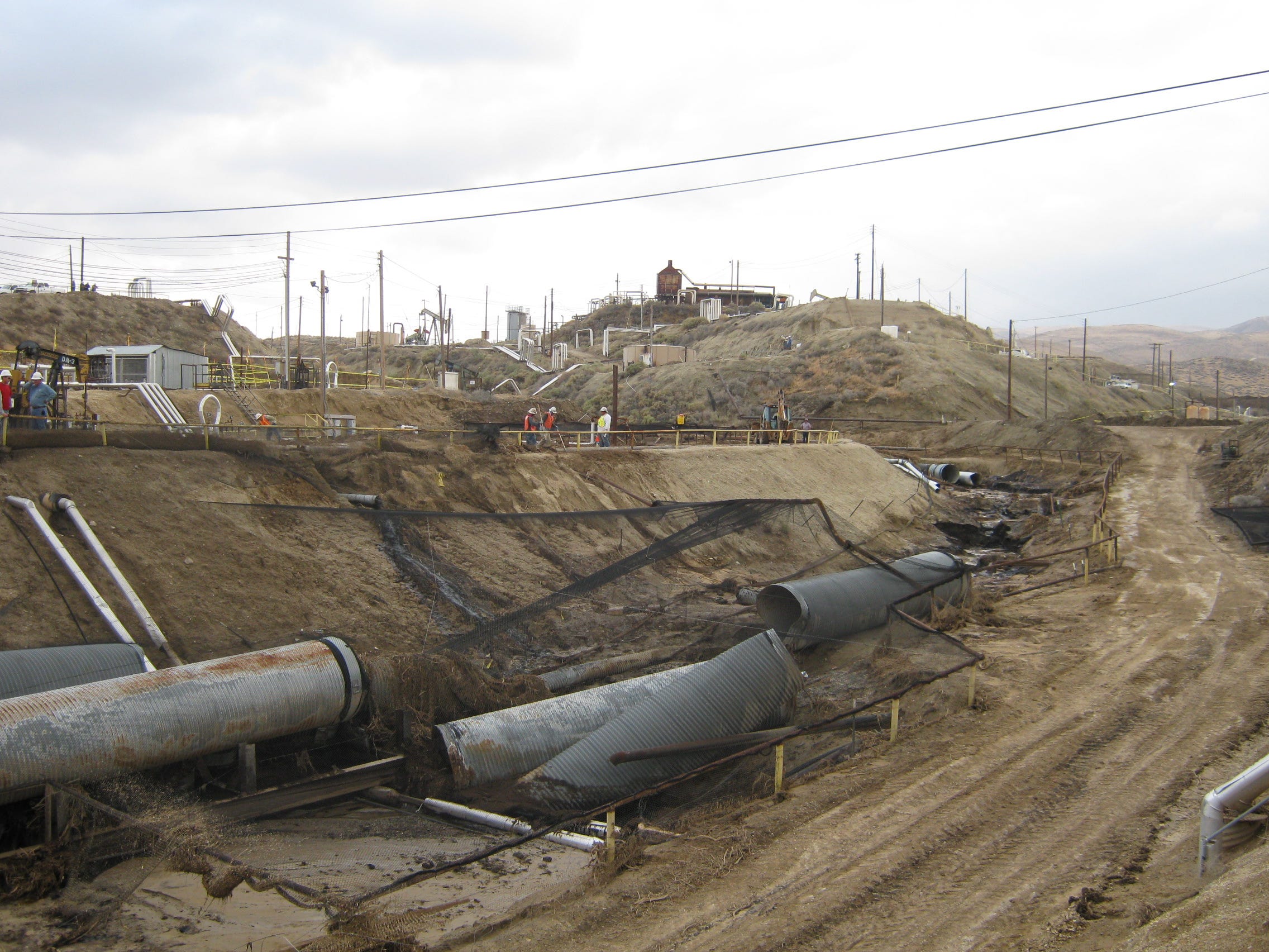 The aftermath of flash floods in Sandy Creek, where Aera had installed a metal culvert to divert rainwater from its natural path.