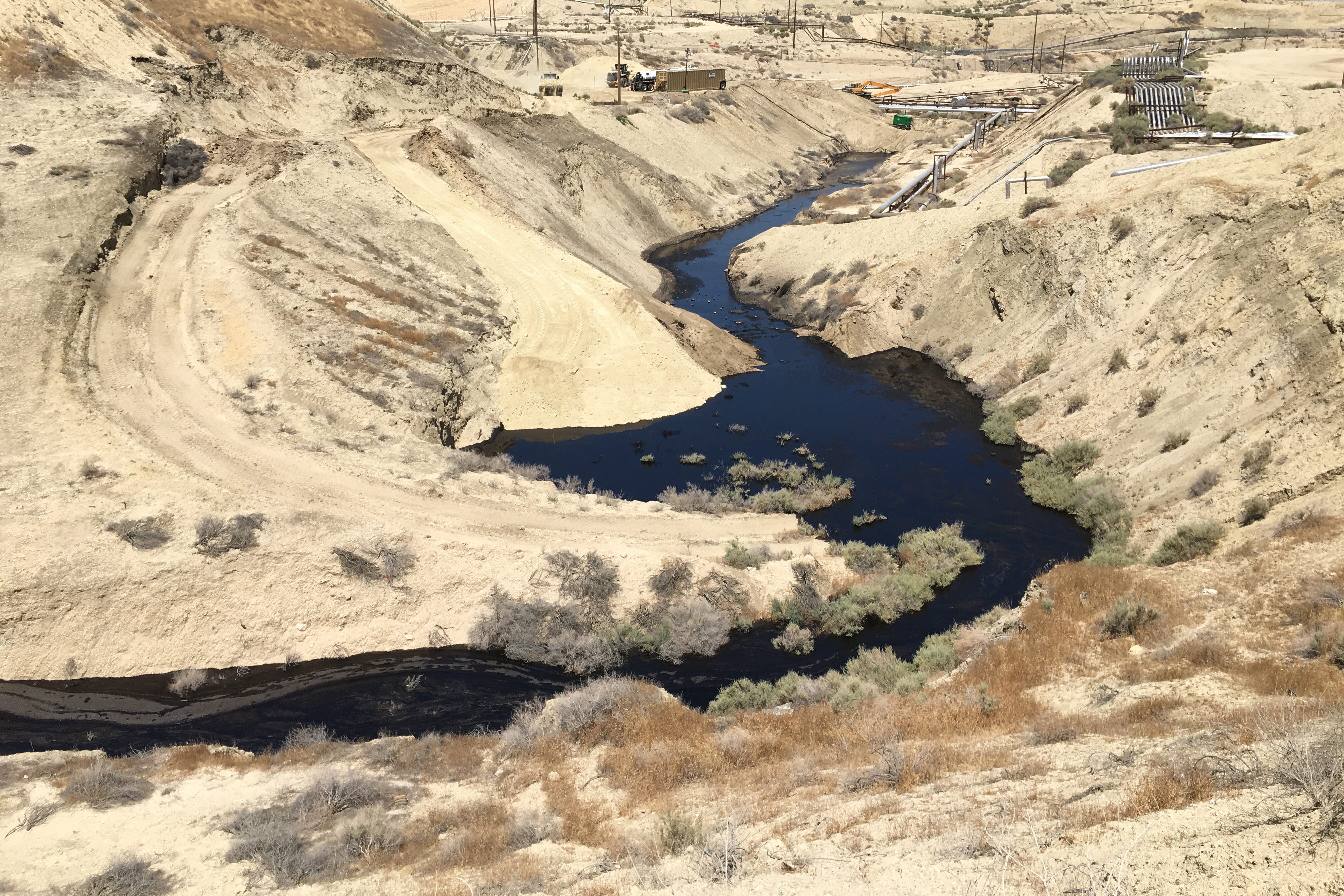 A river of oil spills across the Cymric field near McKittrick, California, in June 2019.