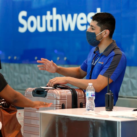 Southwest Airlines employee Oscar Gonzalez, right,
