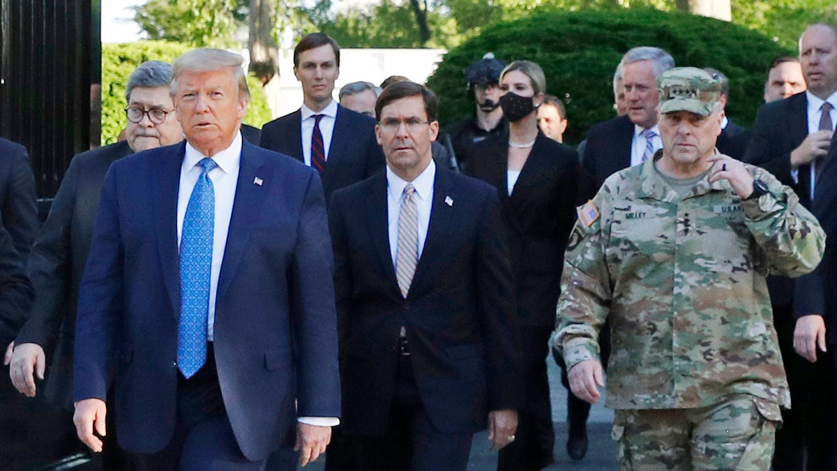 President Donald Trump departs the White House to visit outside St. John's Church, in Washington on June 1, 2020. Part of the church was set on fire during protests on Sunday night. Walking behind Trump from left are, Attorney General William Barr, Secretary of Defense Mark Esper and Gen. Mark Milley, chairman of the Joint Chiefs of Staff.  Milley says his presence 
