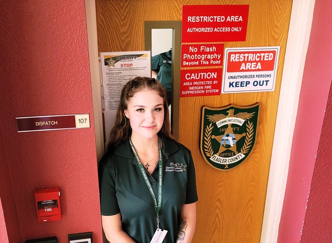 McKenzie Davis stands outside Flagler's 9-1-1 dispatch room where she helped saved two lives with CPR instructions over the phone.