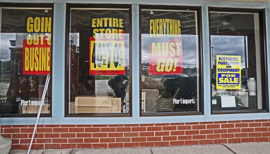 Signs in the windows of Pier 1 at Brookfield Fashion Center, 16720 W. Blue Mound Road, announce the store is going out of business. The pandemic has been especially harsh on the retail industry.