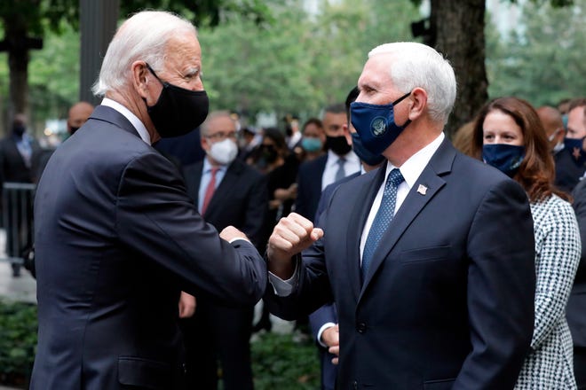 Democratic presidential candidate former Vice President Joe Biden greets Vice President Mike Pence at the 19th anniversary ceremony in observance of the Sept. 11 terrorist attacks at the National September 11 Memorial & Museum in New York, on Friday, Sept. 11, 2020.
