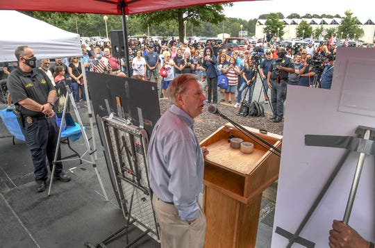 Anderson Chief of Police Jim Stewart, left, stands near U.S. Sen. Lindsey Graham, speaking to a crowd during the Anderson County Drive to Back the Blue at the Civic Center of Anderson Saturday, September 12, 2020.