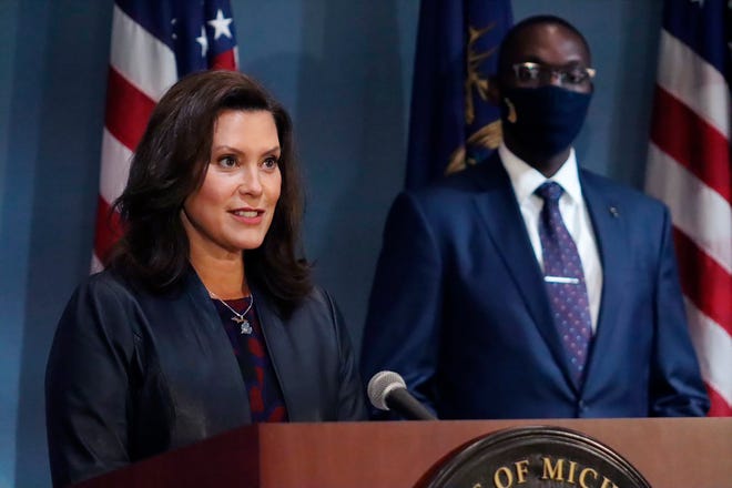Michigan Gov. Gretchen Whitmer addresses the state during a speech in Lansing, Mich. Whitmer opposes a ballot drive that would rescind a 75-year-old law that has enabled her to issue and lift COVID-19 restrictions unilaterally.