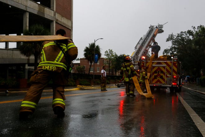 Firefighters respond to a fire in Ben Hill Griffin Stadium on Saturday. Firefighters found smoke coming from the third level and determined the fire was started from a tractor. The relatively minor fire required an extensive response by Gainesville Fire Rescue because of its location in a large, tall building in which people often exercise.