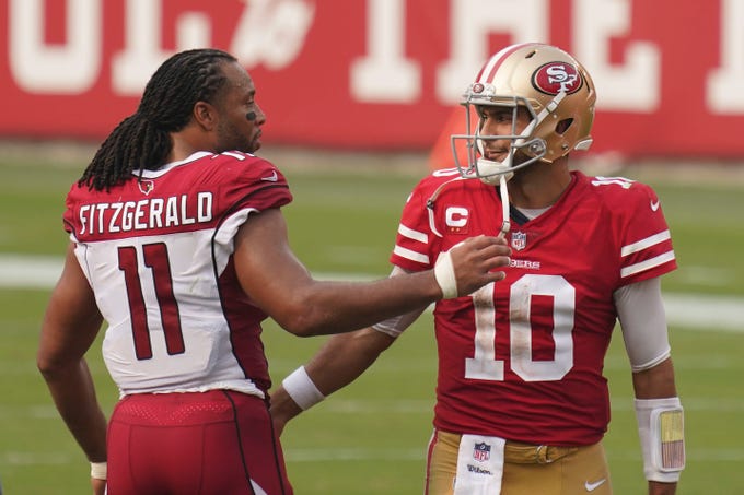 September 13, 2020; Santa Clara, California, USA; Arizona Cardinals wide receiver Larry Fitzgerald (11) shakes hands with San Francisco 49ers quarterback Jimmy Garoppolo (10) after the game at Levi's Stadium. Mandatory Credit: Kyle Terada-USA TODAY Sports
